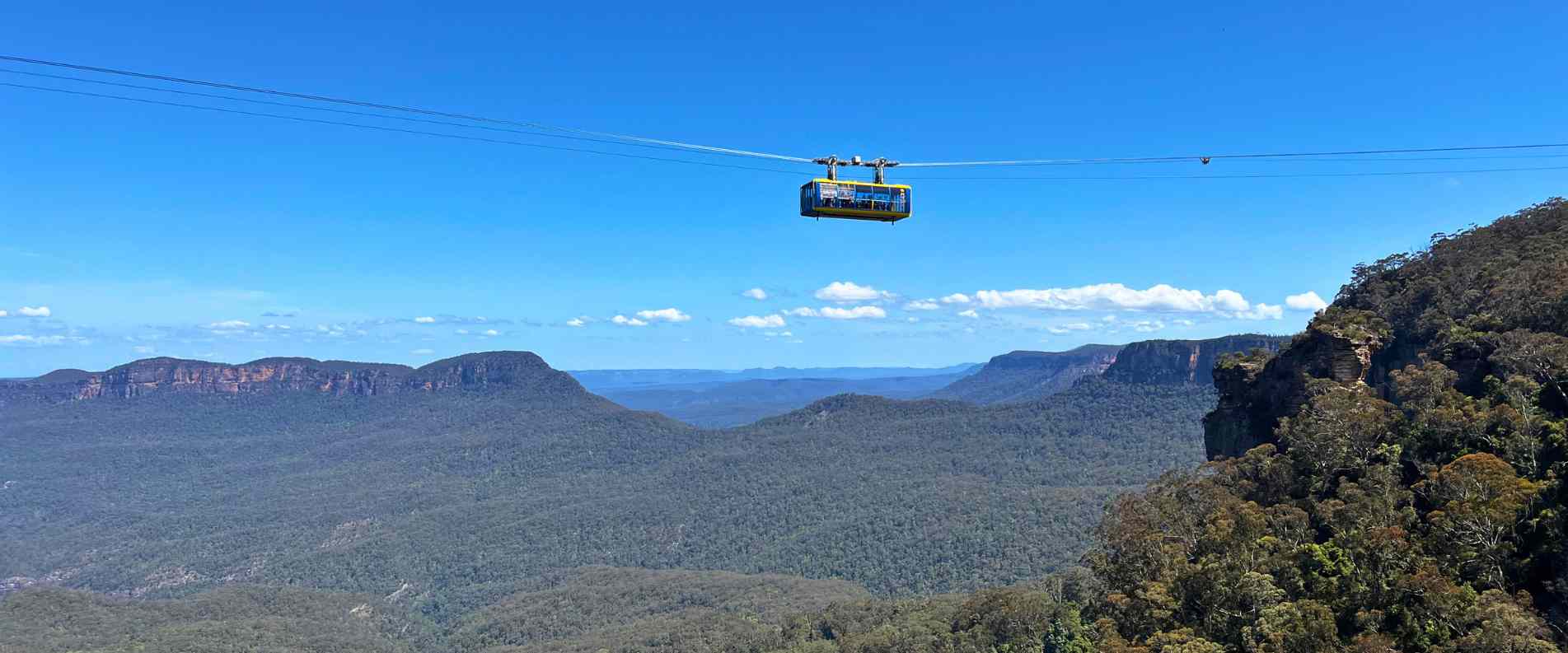 The Scenic World SkyWay Sky gondola positioned over a deep canyon in the Blue Mountains, NSW
