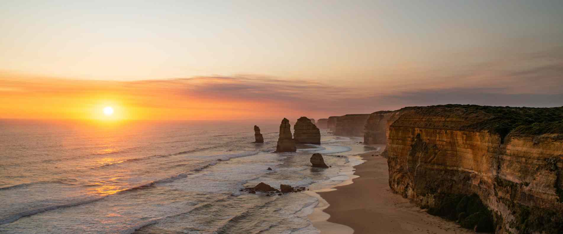 A soft sun set over the 12 Apostles on the great ocean road
